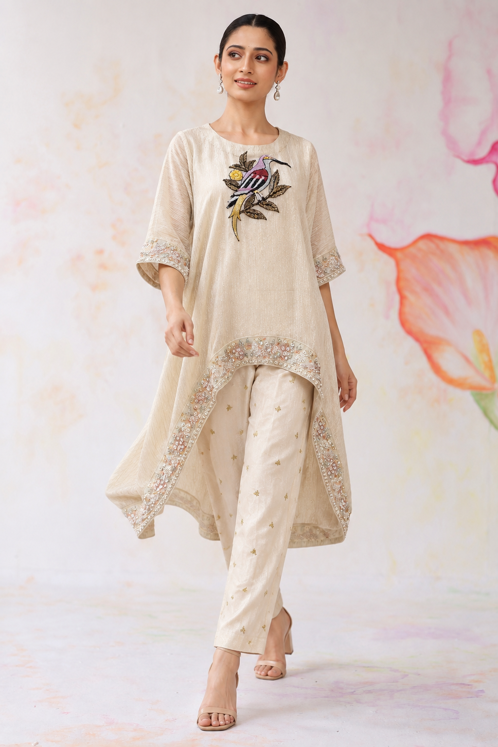 Parvaaz by House of Somarra — Walking view showing the asymmetric kaftan hem and cigarette pants.
