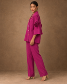 Rangika by House of Somarra — Side view showing the loose shirt and straight trousers.
