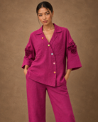 Rangika by House of Somarra — Close-up of the pointed collar, buttons and sculpted sleeve flowers.