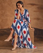 Raavika by House of Somarra — Seated view showing the long printed kurta and split hem.