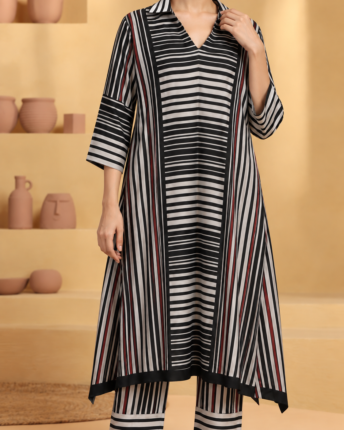 Tirya by House of Somarra — Close-up of the collar and alternating stripe panels.