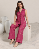 Mrigakshi by House of Somarra — Seated view showing the small antelope motifs and pink trousers.