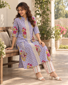 Eshani by House of Somarra — Seated view showing the floral motifs and printed trousers.