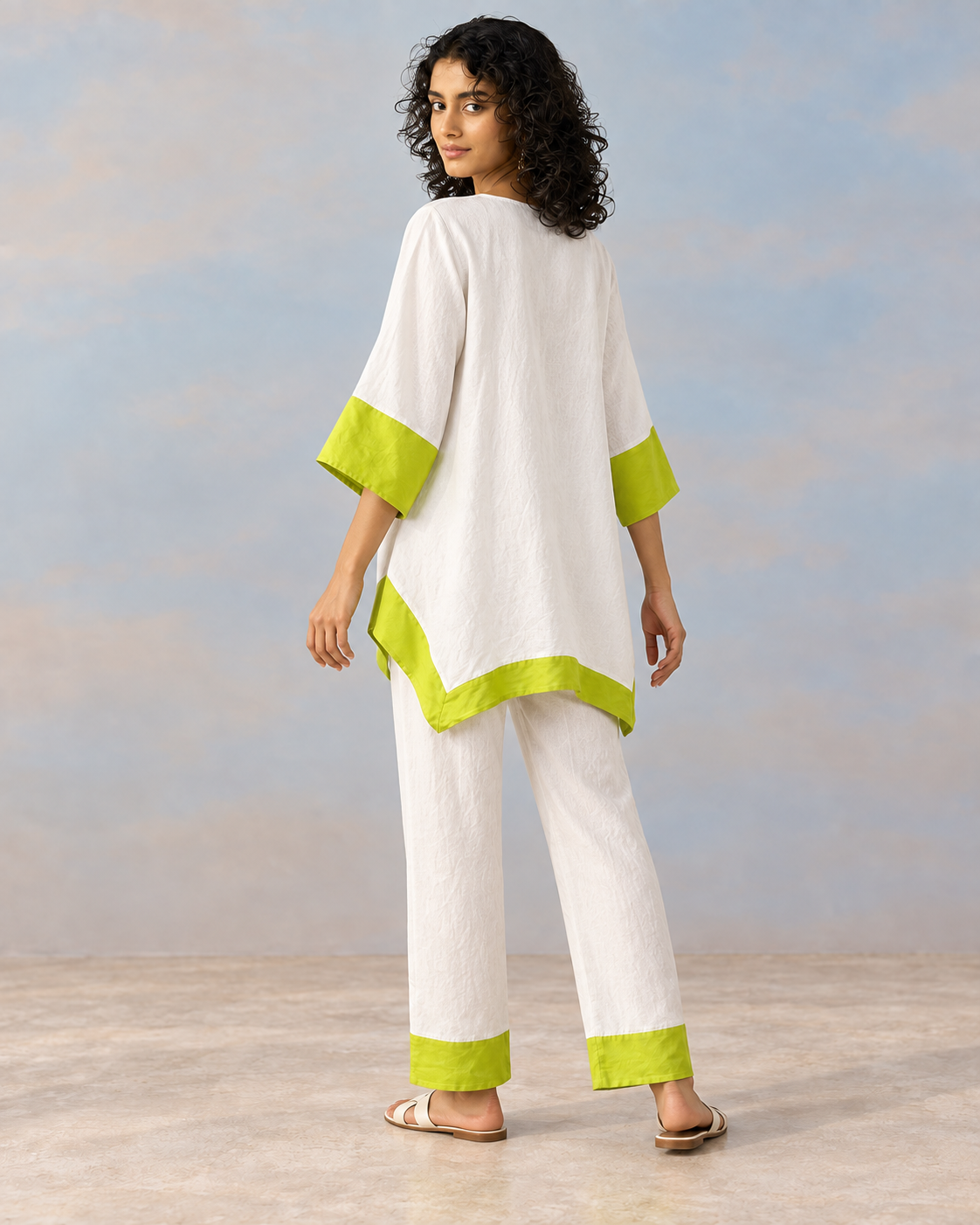 Elara by House of Somarra — Back view showing the white tunic and lime hem.