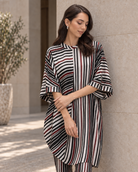 Vayra by House of Somarra — Portrait view of the black, white and red striped cowl tunic.