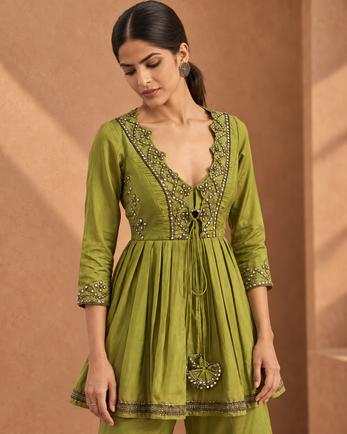Madhavi by House of Somarra — Portrait view of the green bodice embroidery and decorative tassels.