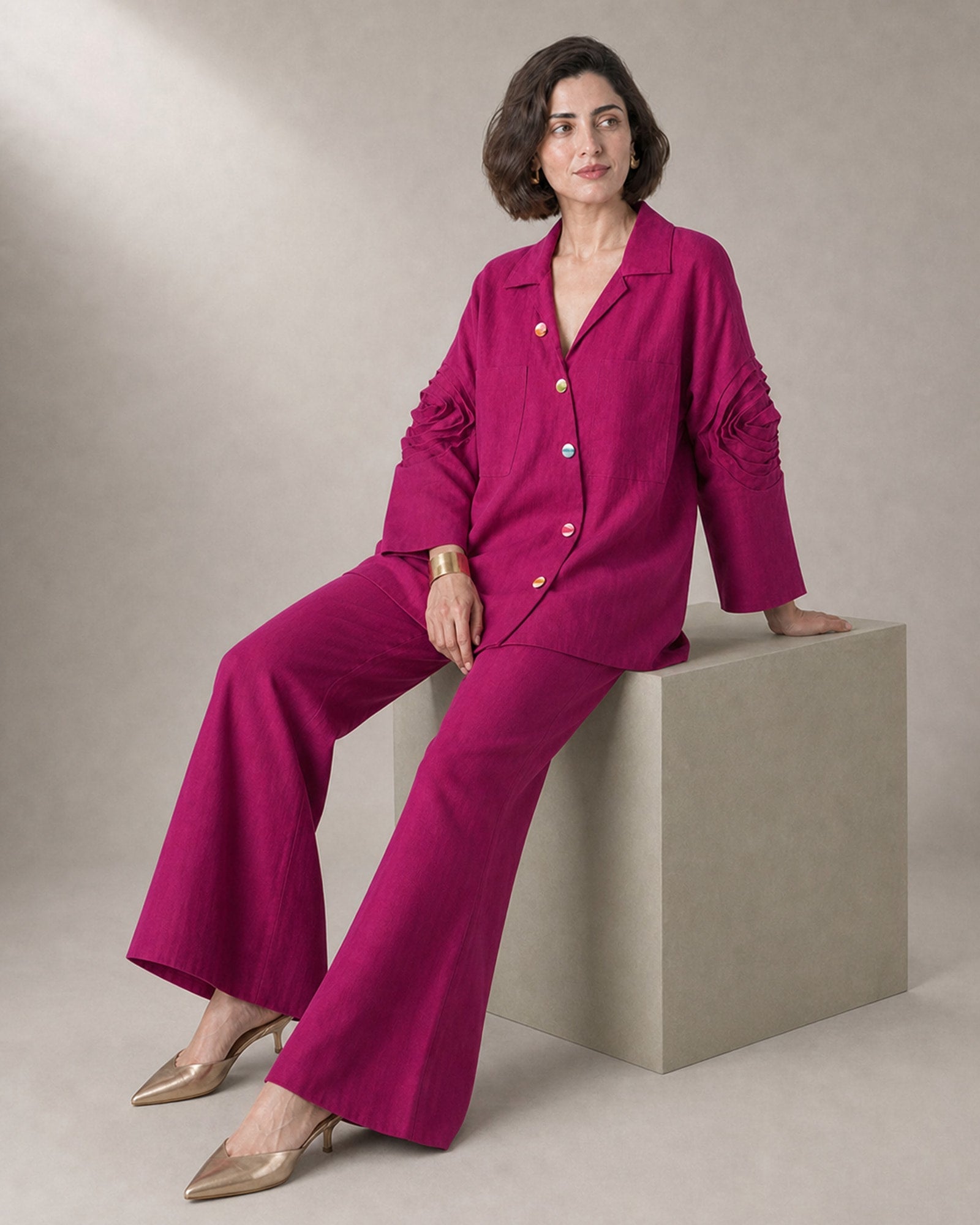 Rangika fuchsia sculpted linen-cotton co-ord set – edge-perch view showing sleeves and bell trousers