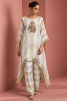 Kashvi by House of Somarra — Front view showing the loose ivory kaftan and trouser silhouette.