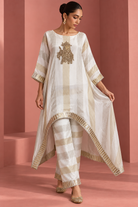 Kashvi by House of Somarra — Full-length front view of the ivory striped kaftan and matching trousers.