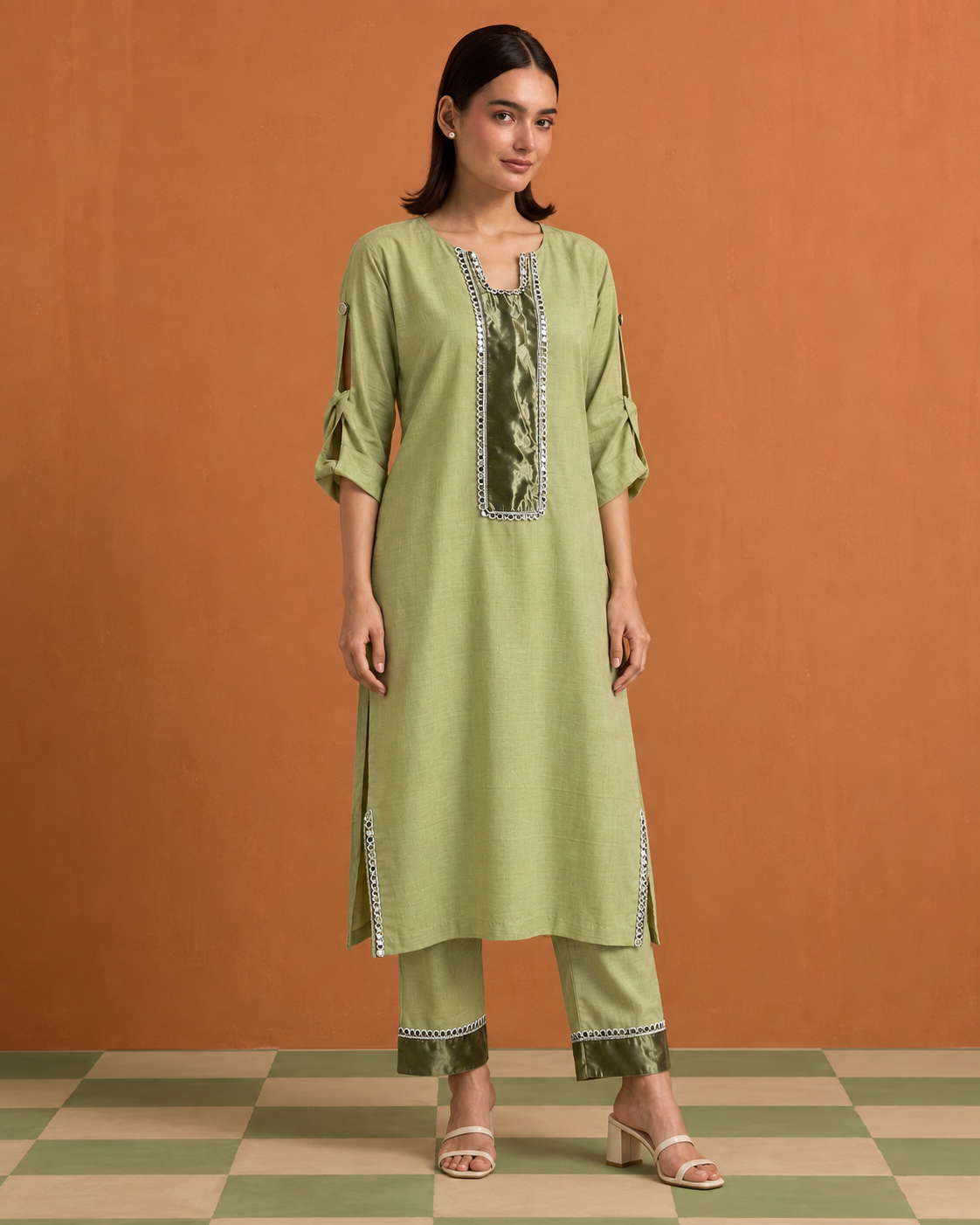 Aabha by House of Somarra — Front view of the pale green-gold tunic and matching trousers.