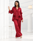 Laalima by House of Somarra — Walking view showing the red shirt and wide trouser silhouette.
