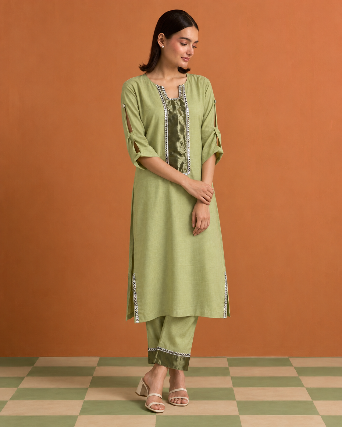Aabha by House of Somarra — Walking view showing the tunic's loose fit and tied sleeves.