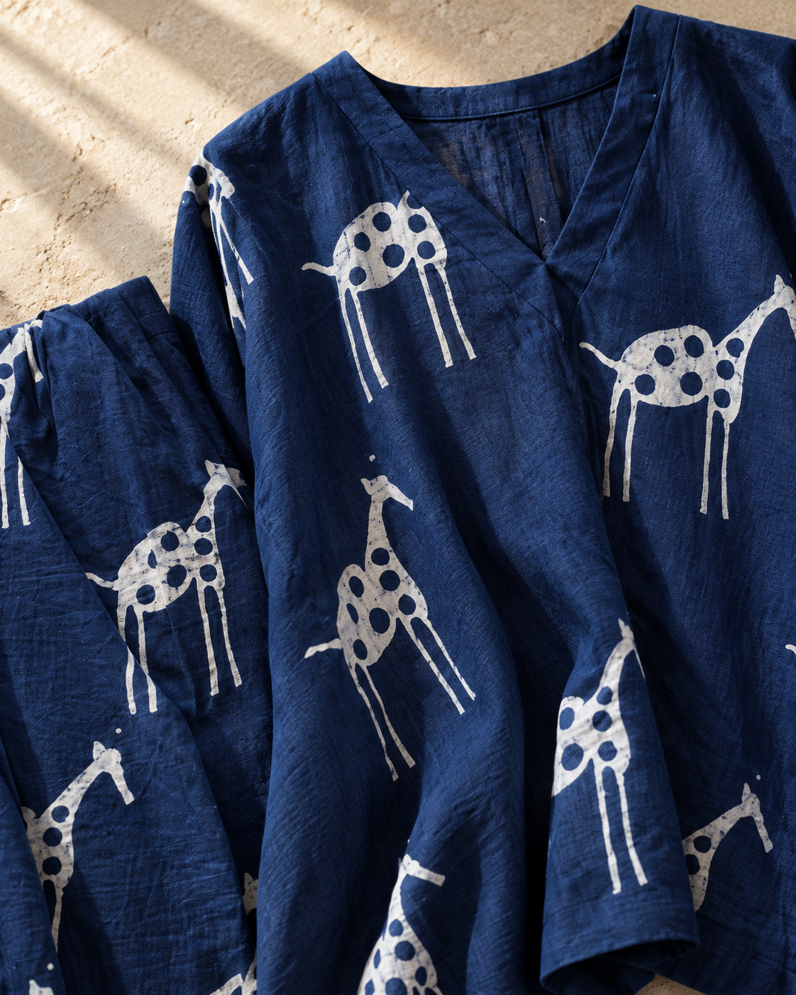 Indira — close-up of the navy and ivory motif design