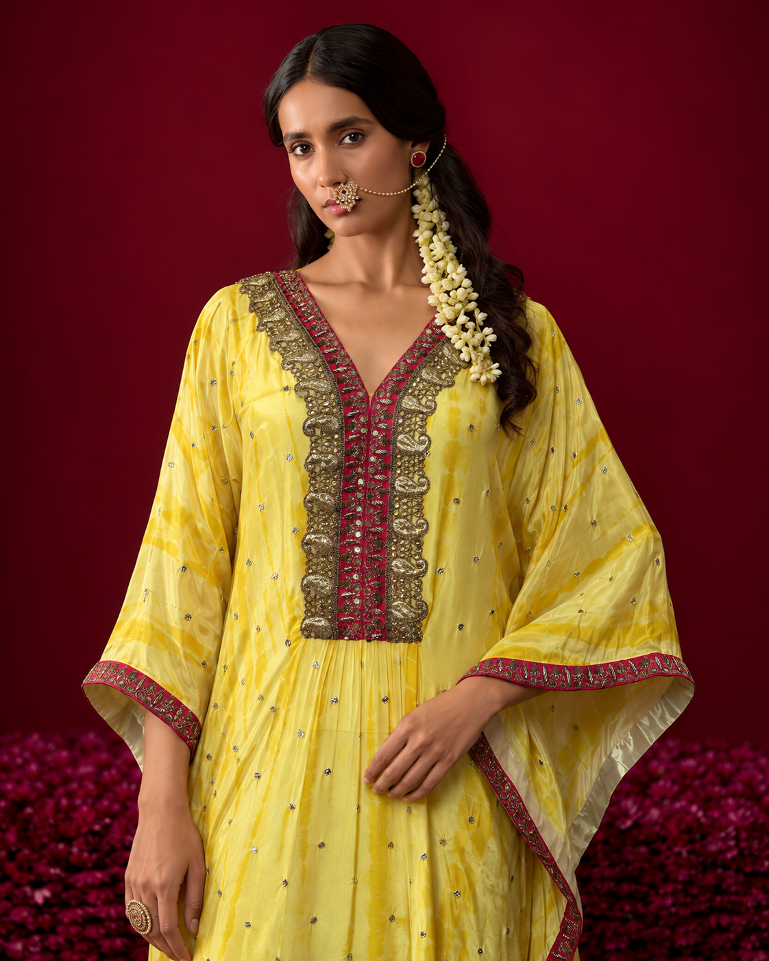 Amara by House of Somarra — Mid-length view of the embellished front panel and flowing sleeves.