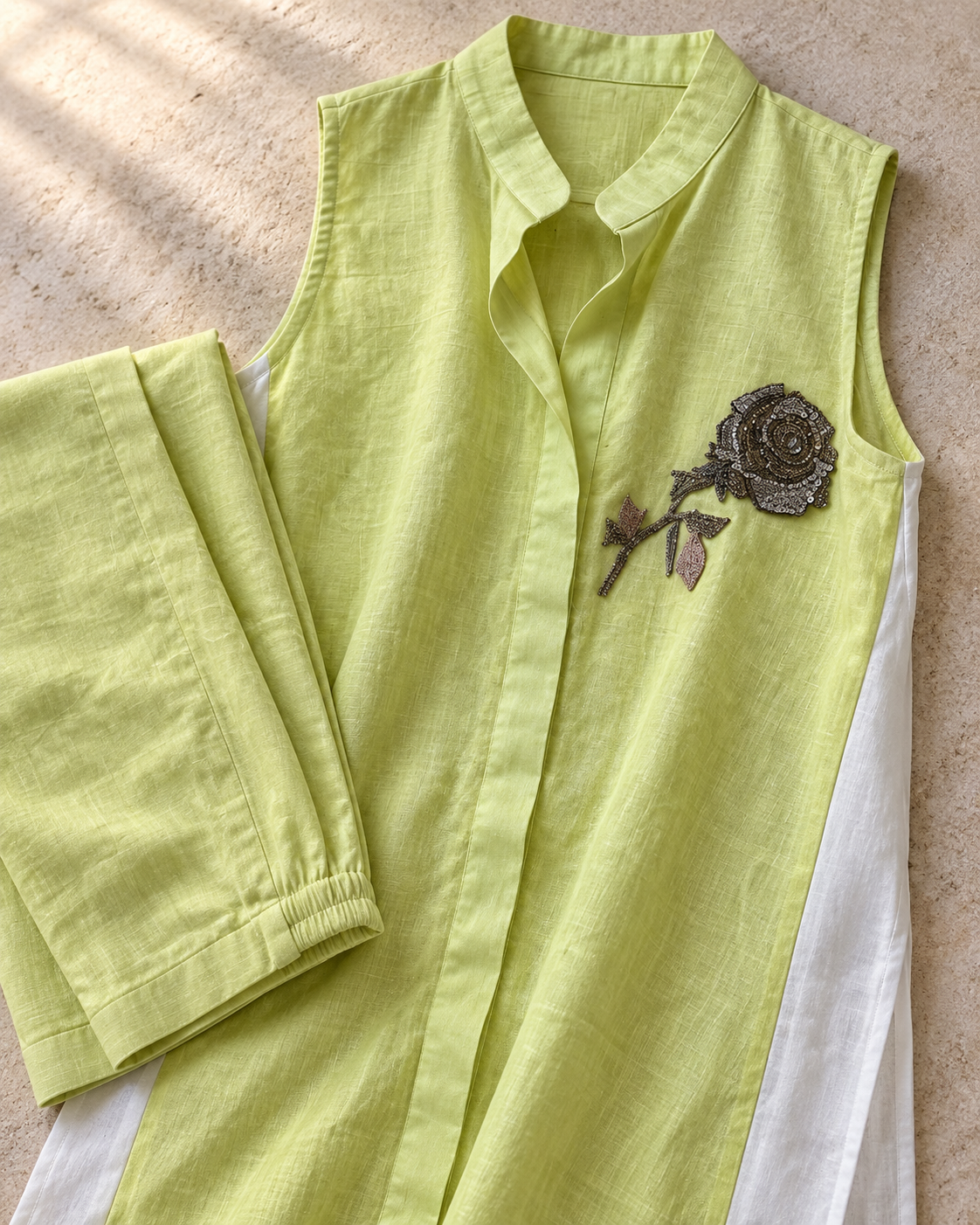 Iraaya by House of Somarra — Flat-lay close-up of the pointed collar and embroidered motif.