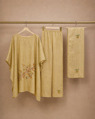 Hanger packshot of the Taru solder-beige Chanderi-material co-ord upper, narrow bottom and stole