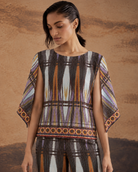 Aroha by House of Somarra — Close-up of the round neckline, mosaic pattern and loose sleeves.