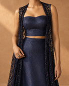 Metallic detailing on the Nilaya navy bustier and lace overlay, close-up