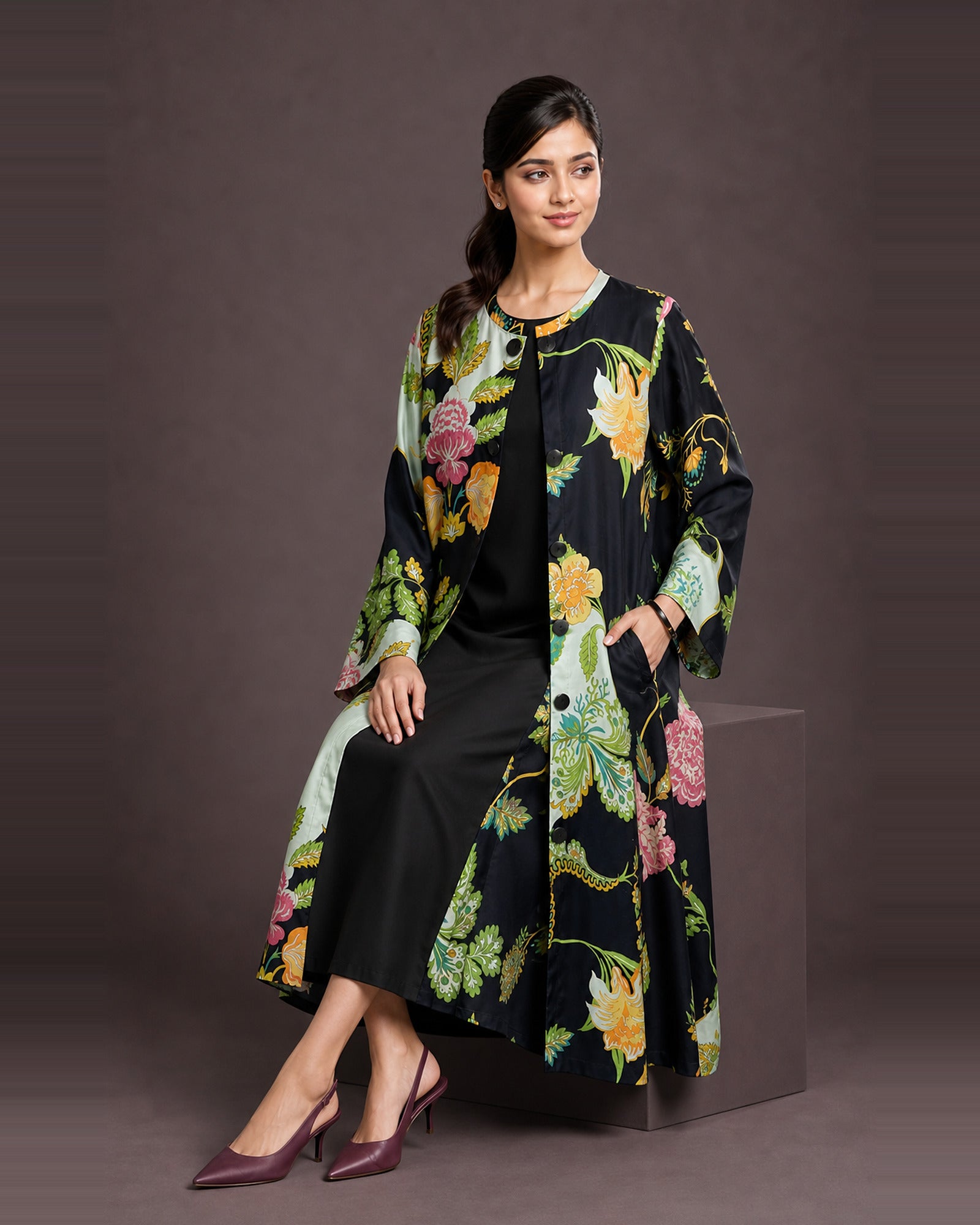 Three-quarter view of the Vanika botanical-print modal-satin midi dress, showing a side pocket and black inner at the front opening