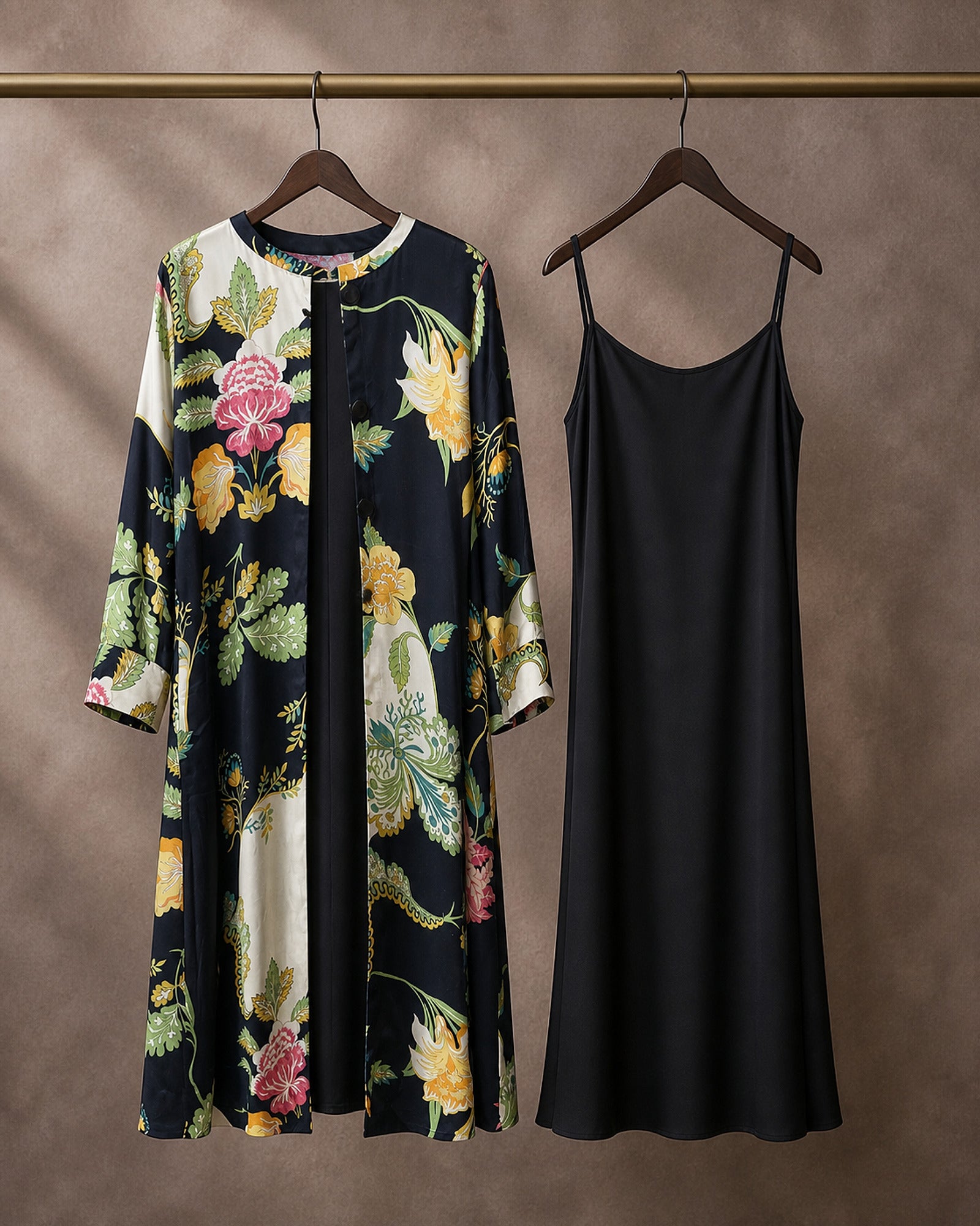 Hanger packshot of the Vanika botanical-print modal-satin front-open midi dress with its separate plain black modal-satin inner