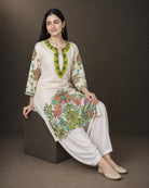 Vasantika: Ivory Botanical Embroidered Kurta & Draped Dhoti Set – low-block seated drape view