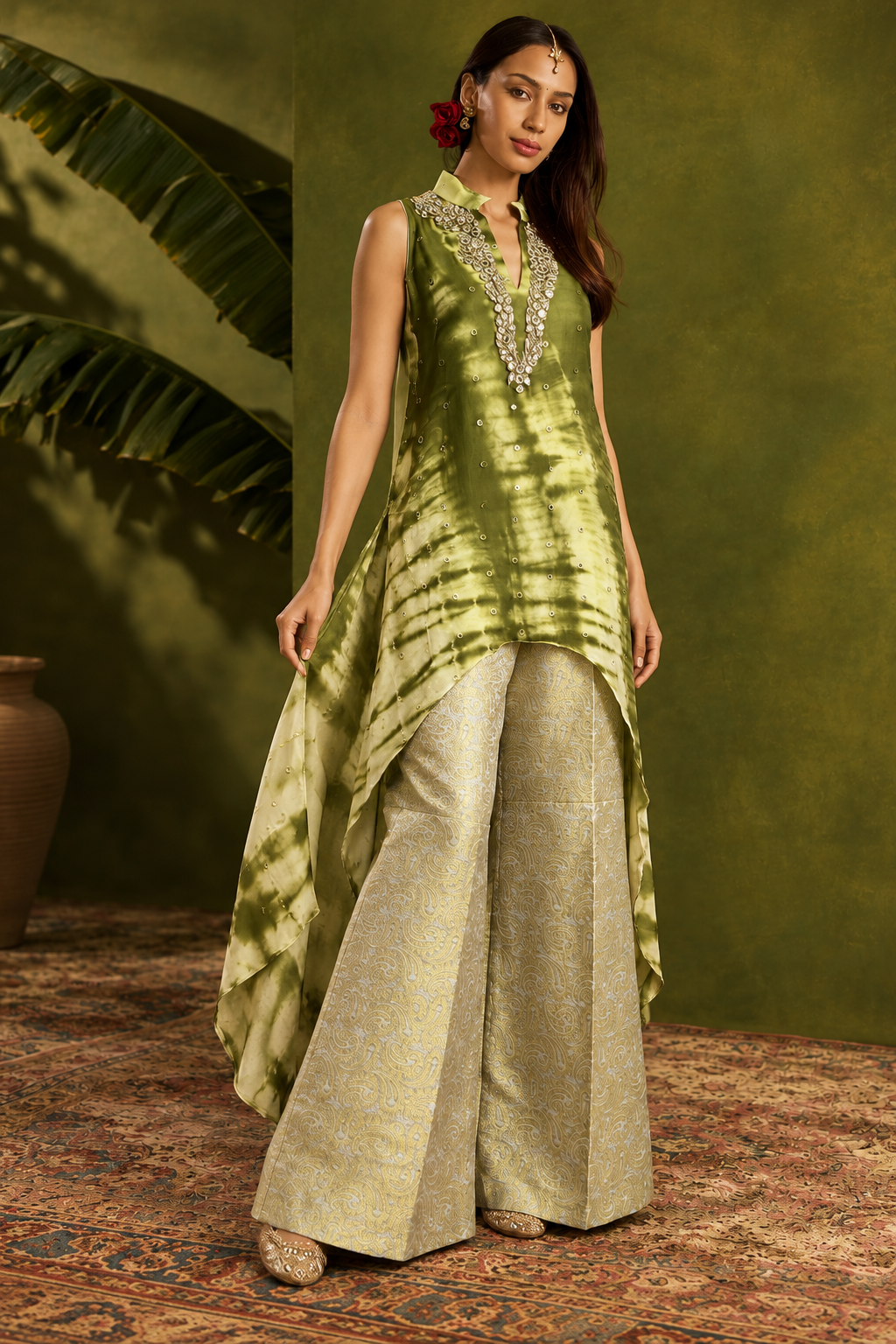 Aiza by House of Somarra — Walking view showing the asymmetric tunic hem and wide trousers.