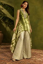 Aiza by House of Somarra — Walking view showing the asymmetric tunic hem and wide trousers.