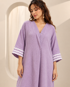 Ameera by House of Somarra — Portrait view of the lilac tunic and white threadwork sleeve bands.