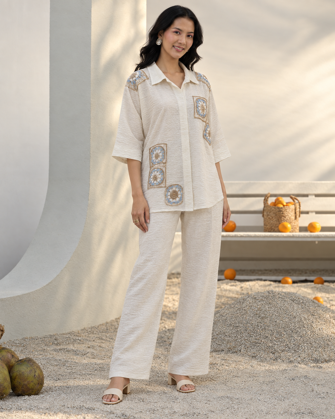 Mihira by House of Somarra — Front view of the cream shirt and trousers with square crochet-style motifs.